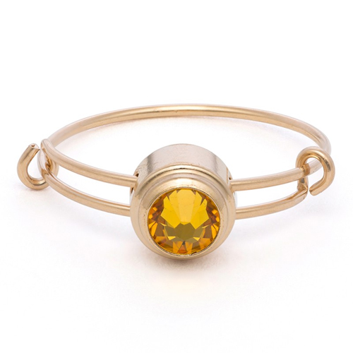 The yellow Alex and Ani Sacred Studs ring