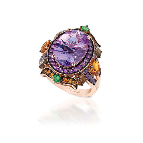 Diamond ring featuring colored diamonds including purple diamonds.