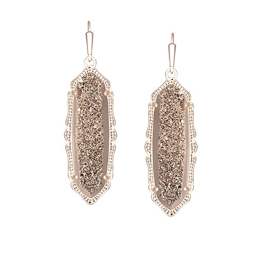 Kendra Scott designs earrings also.