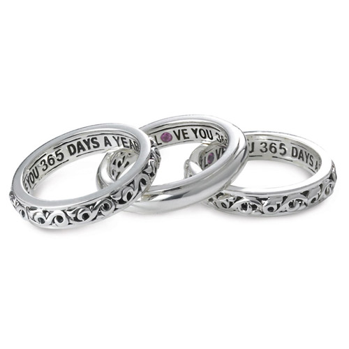 The three rings are inscribed with a love saying for Valentine's Day.