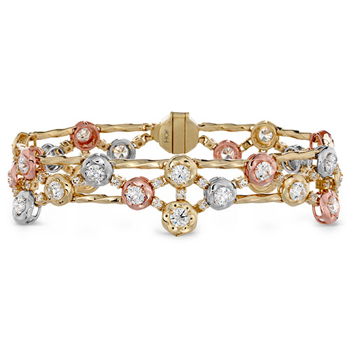 This diamond bracelet features gold, white and yellow gold.